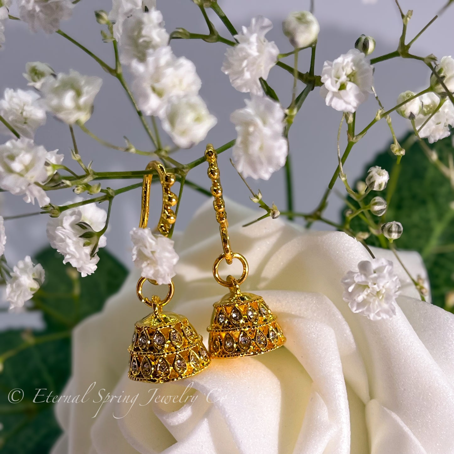 Lightweight, Golden Micro-Jhumka Earrings with Subtle Gold Leaf Pattern & Sparkling Clear Crystals