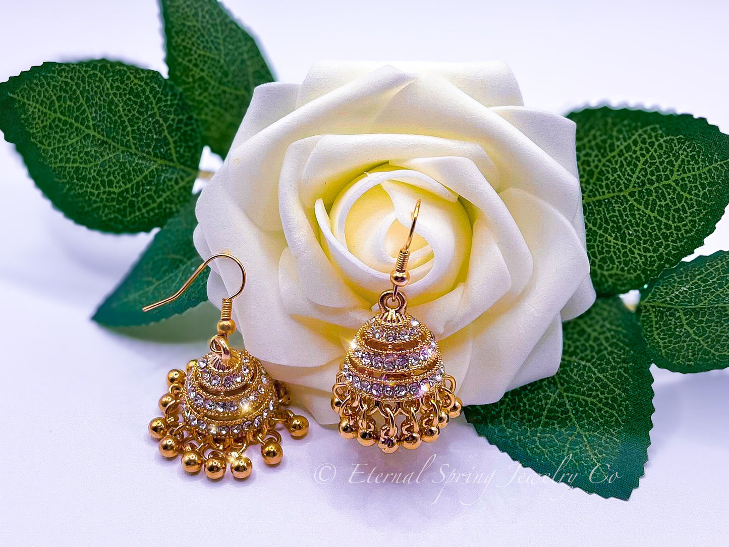 Elegant Golden Jhumka Earrings, Banded with Sparkling Clear Crystals