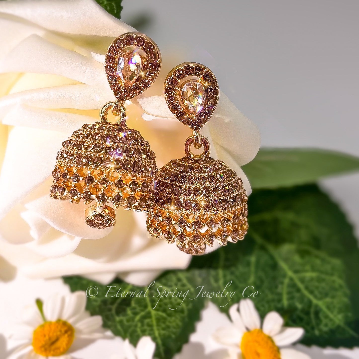 Elegant Golden Jhumka Earrings with Sparkling Champagne Crystals