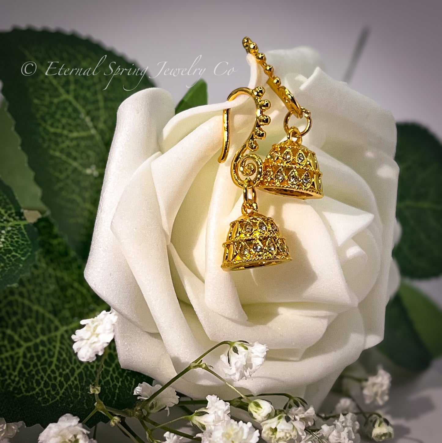 Lightweight, Golden Micro-Jhumka Earrings with Subtle Gold Leaf Pattern & Sparkling Clear Crystals