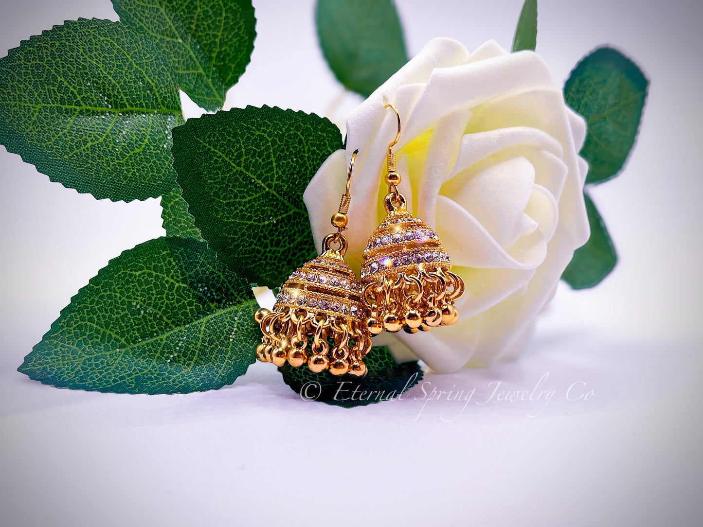 Elegant Golden Jhumka Earrings, Banded with Sparkling Clear Crystals